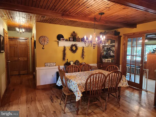 a view of yard with swimming pool and outdoor seating