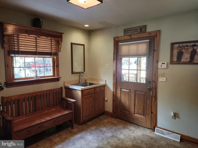 a view of outdoor space with deck and trees