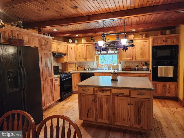 a view of a brick wall with an outdoor space