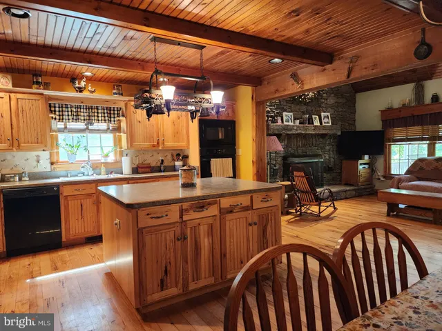 a porch with a bench next to a yard