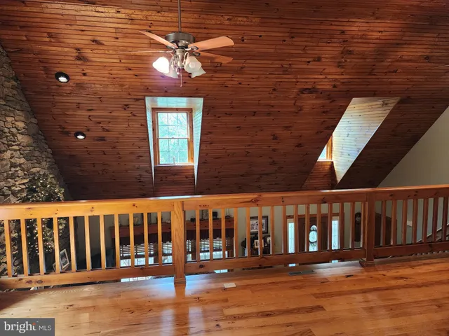 a bathroom with a tub and a window