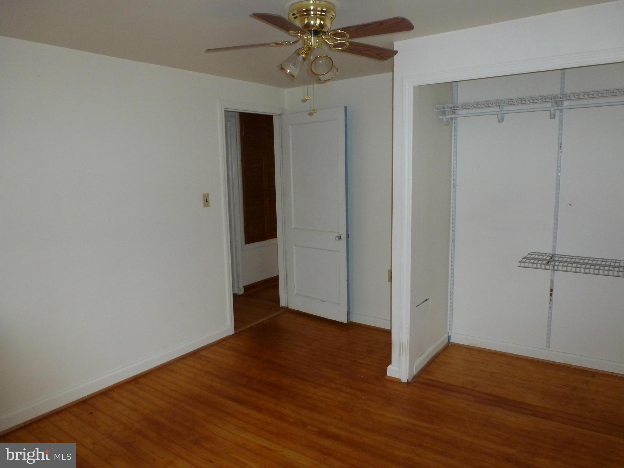 10321 Bethel Road Frederick, MD 21702 - Photo 12 of 18 a view of an empty room with wooden floor
