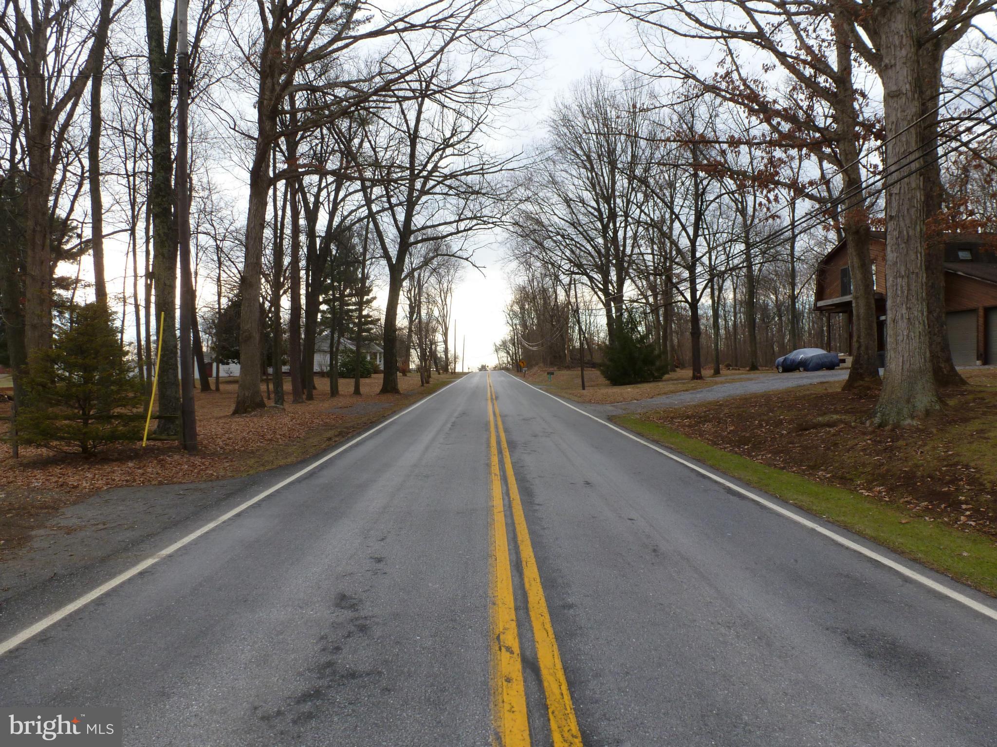 10321 Bethel Road Frederick, MD 21702 - Photo 5 of 18 a view of a street with trees in front of it