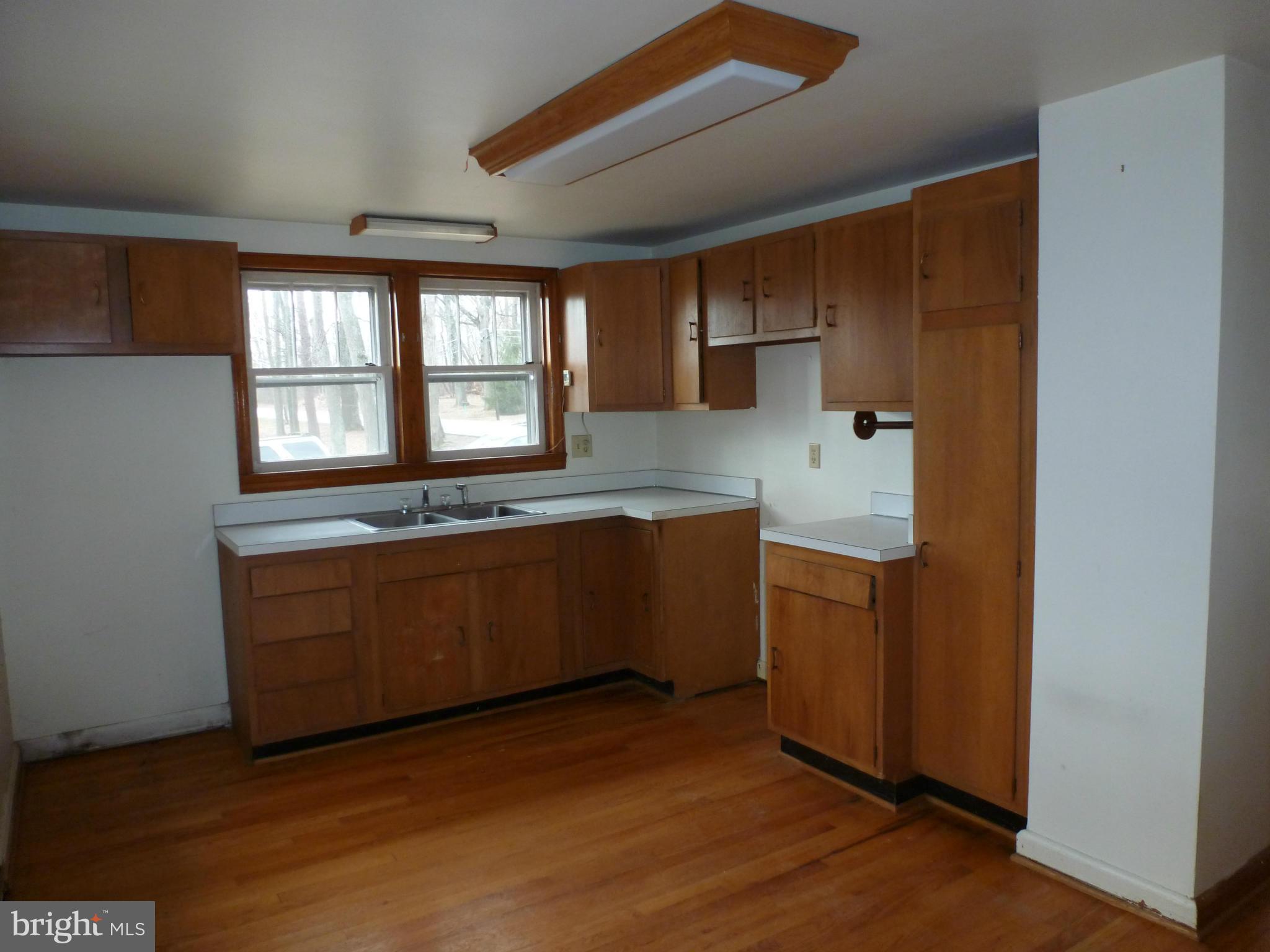 10321 Bethel Road Frederick, MD 21702 - Photo 10 of 18 a kitchen with a sink and cabinets