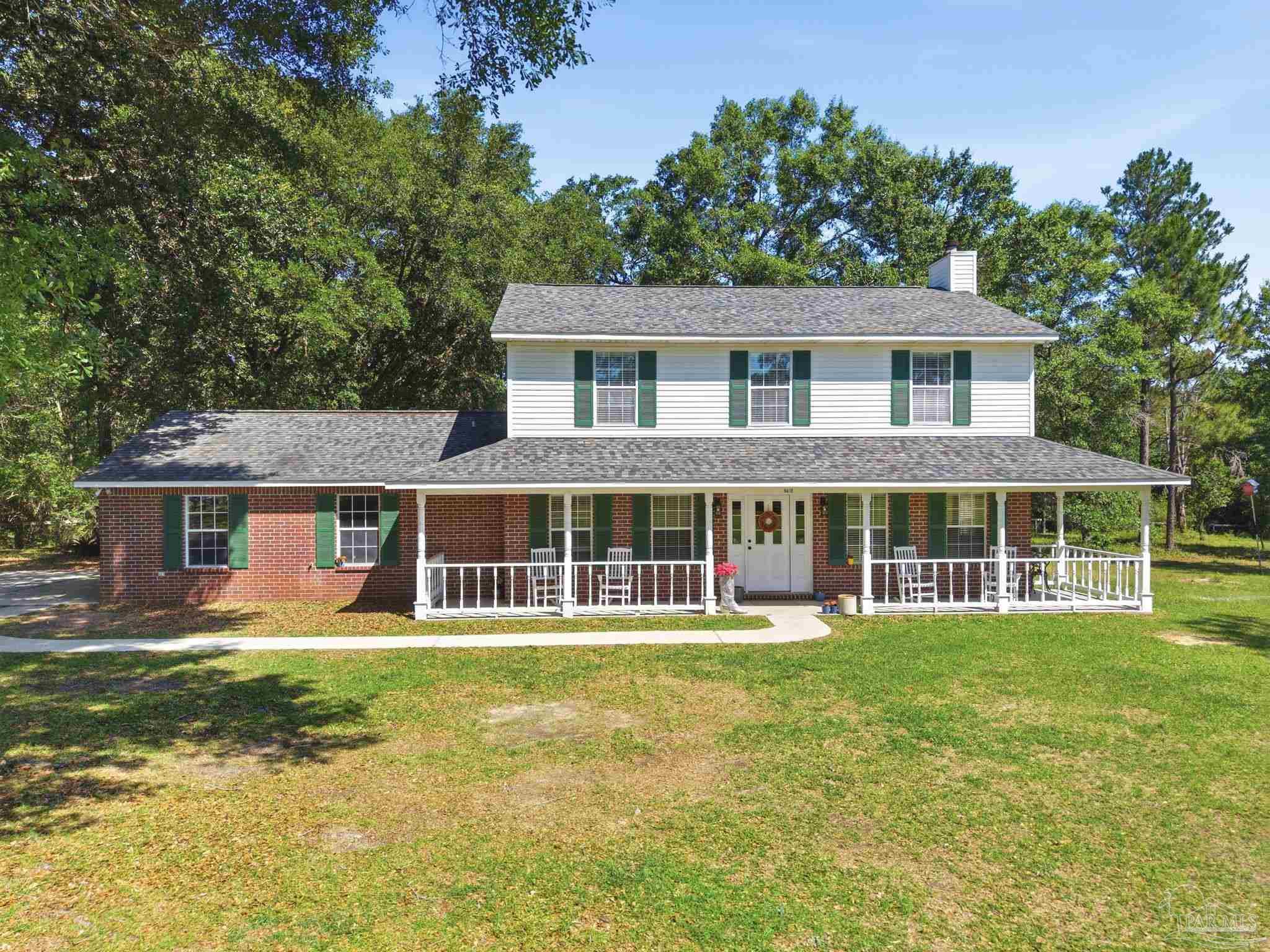 6870 Martin Road Milton, FL 32570 - Photo 2 of 48 front view of a house with a yard