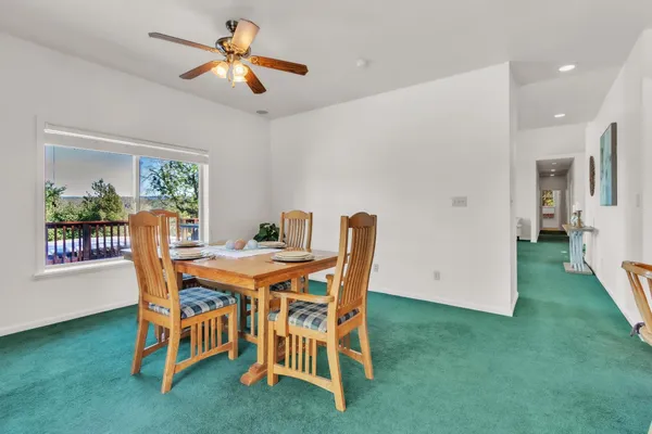 a dining room with furniture and window