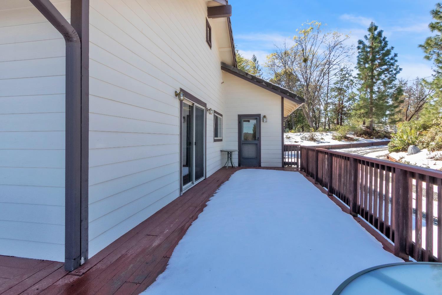 19665 Eagle Ridge Road Foresthill, CA 95631 - Photo 37 of 39 a view of a house with wooden deck front of house