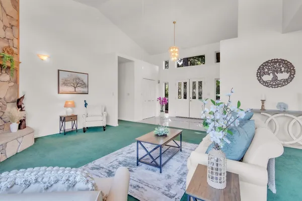 a living room with furniture and a table