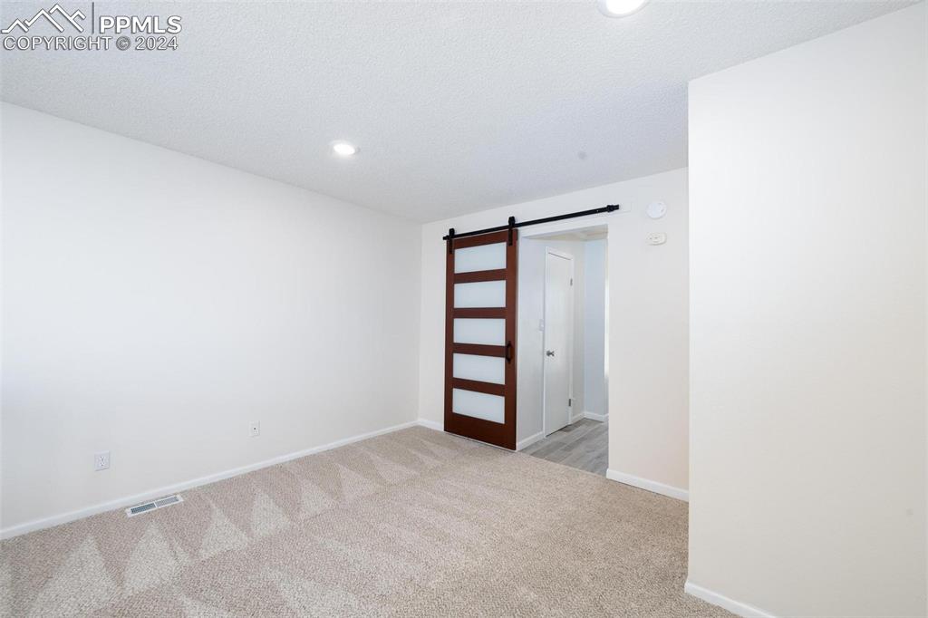 3738 Red Canon Place Colorado Springs, CO 80904 - Photo 13 of 27 a view of an empty room with a closet