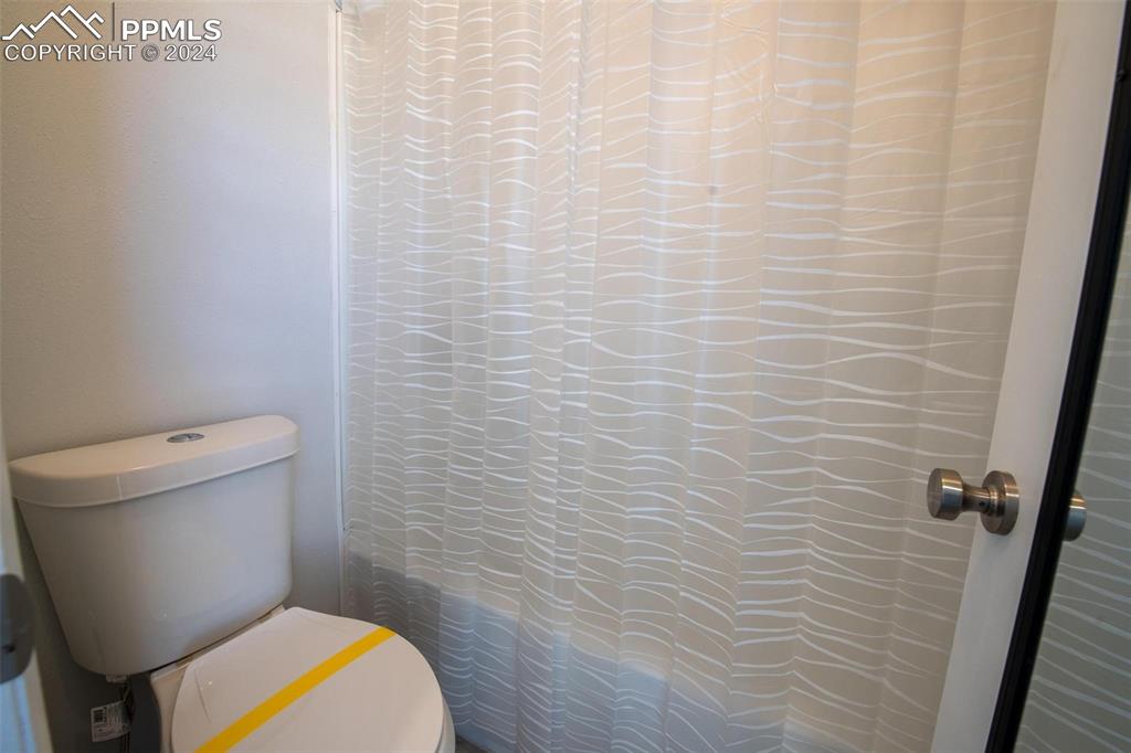 3738 Red Canon Place Colorado Springs, CO 80904 - Photo 14 of 27 a bathroom with a toilet and a shower