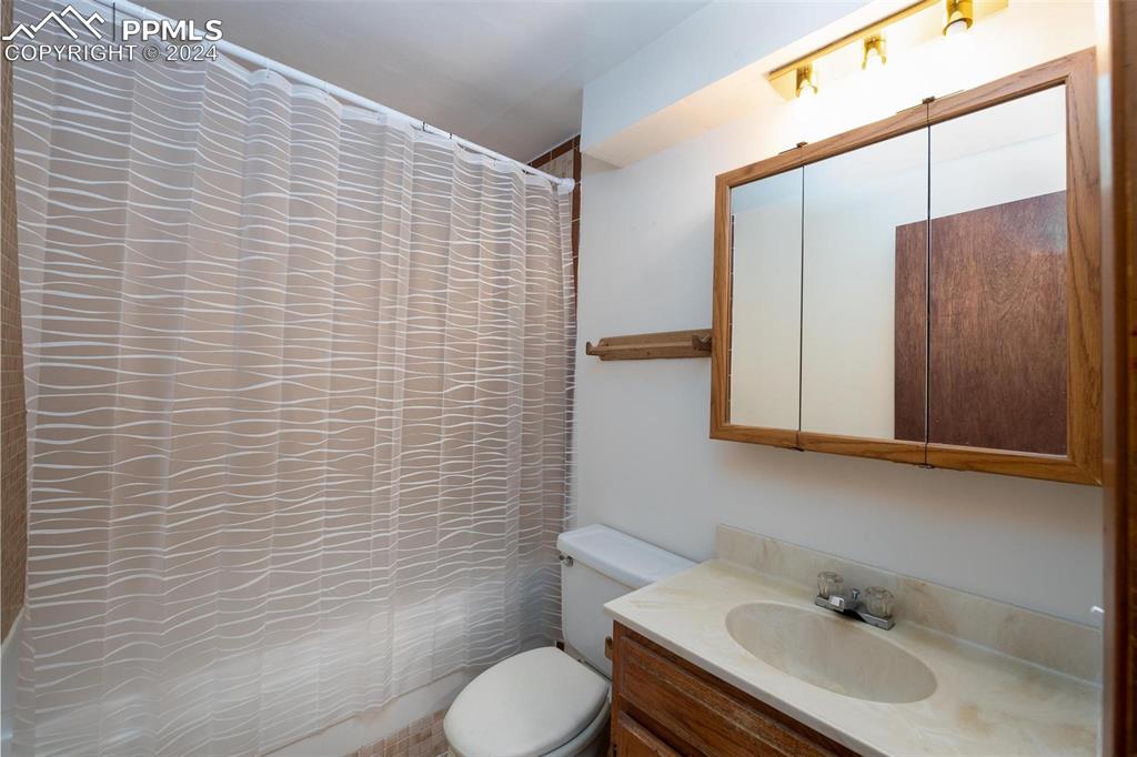 3738 Red Canon Place Colorado Springs, CO 80904 - Photo 17 of 27 a bathroom with a sink and a toilet