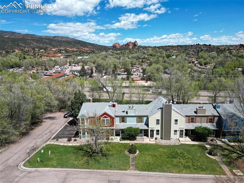 3738 Red Canon Place Colorado Springs, CO 80904 - Photo 19 of 27 an aerial view of residential houses with outdoor space and trees