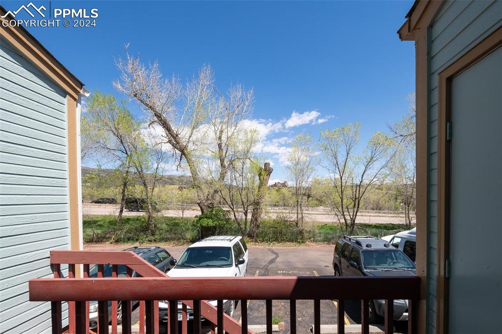 3738 Red Canon Place Colorado Springs, CO 80904 - Photo 27 of 27 a view of a patio with a table chairs and a porch
