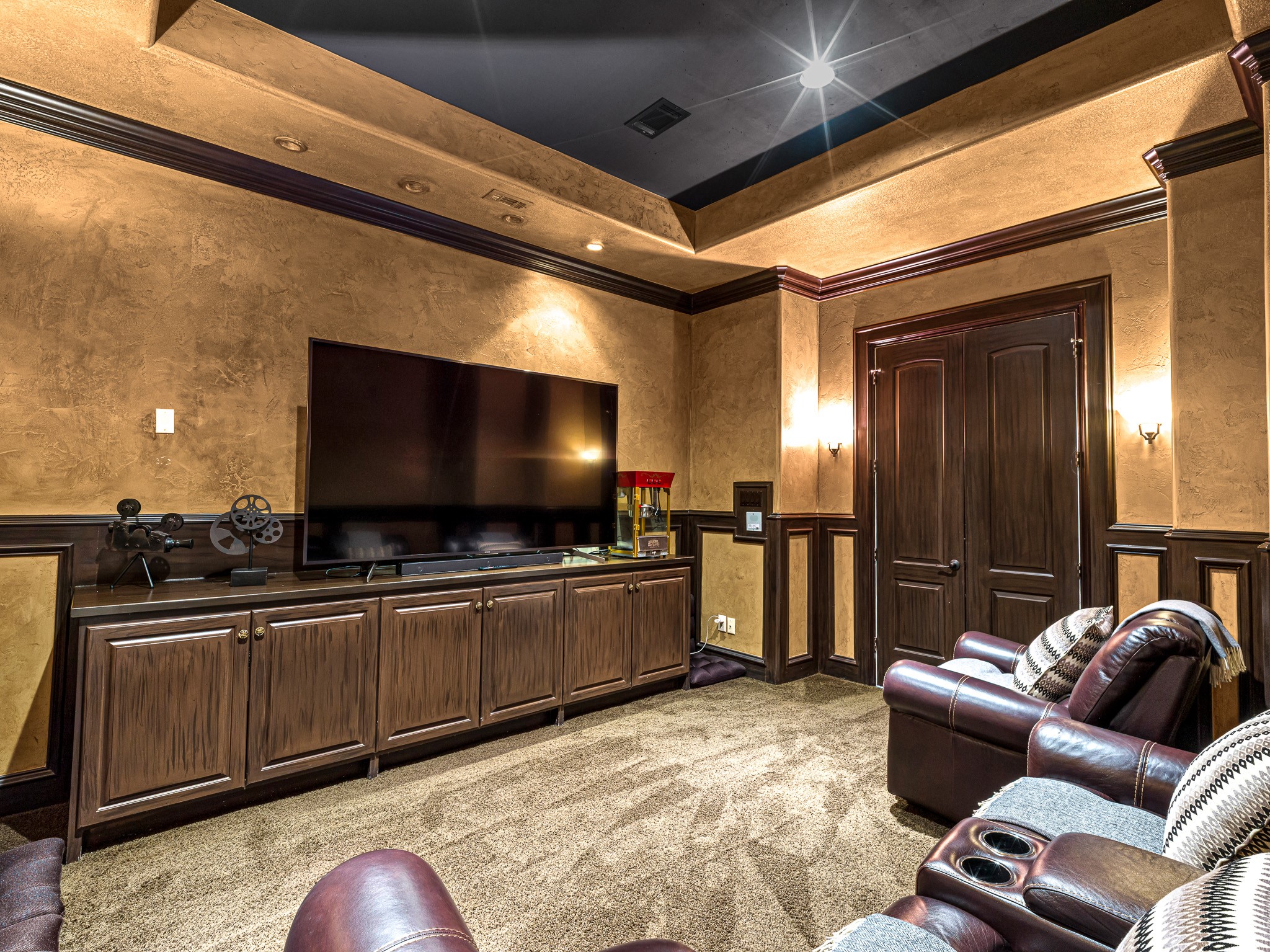 4614 Inker Street Houston, TX 77007 - Photo 29 of 36 Second floor luxurious home theater room with warm wood paneling and ambient lighting, creating an ideal space for movie nights.
