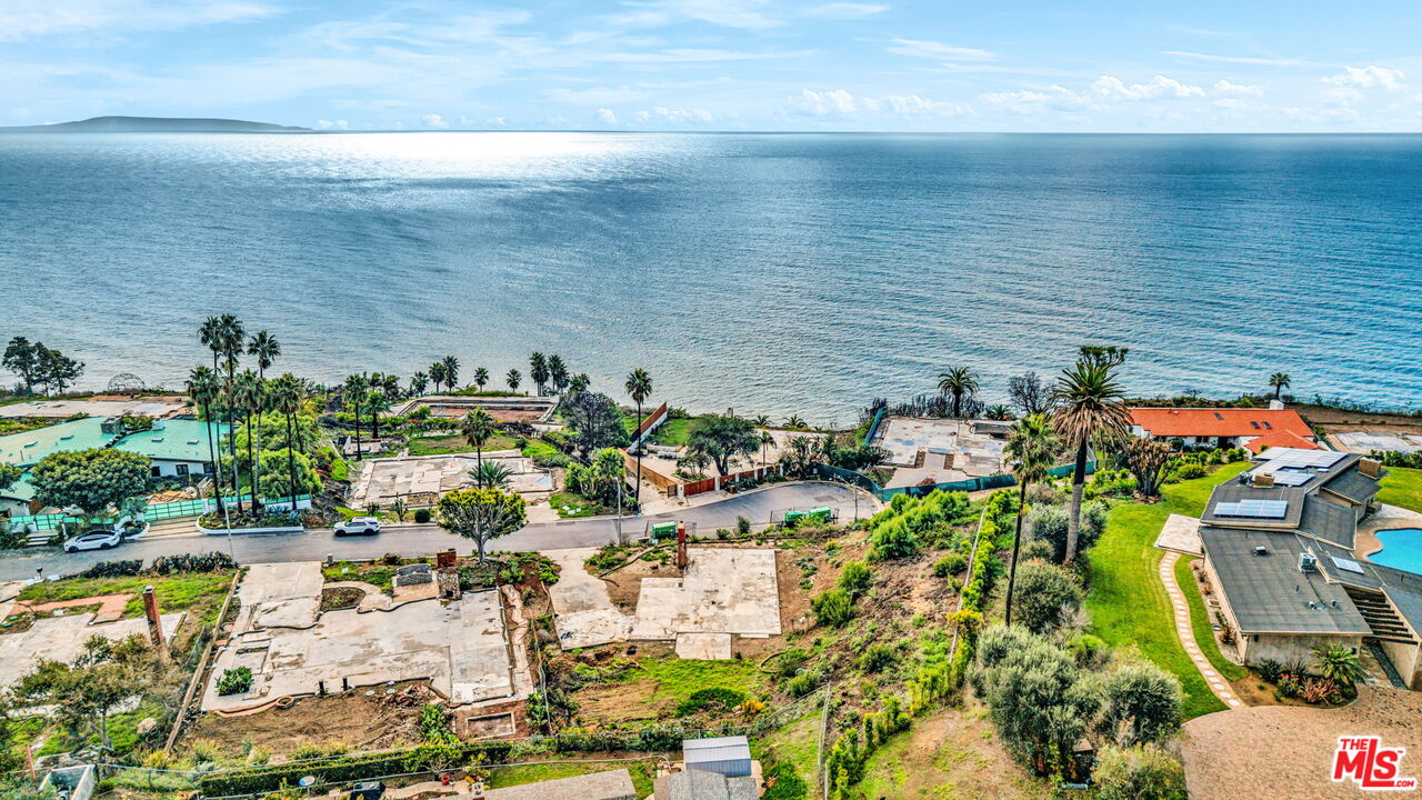 20269 Inland Lane Malibu, CA 90265 - Photo 6 of 11 a view of a lake with a building in front of it