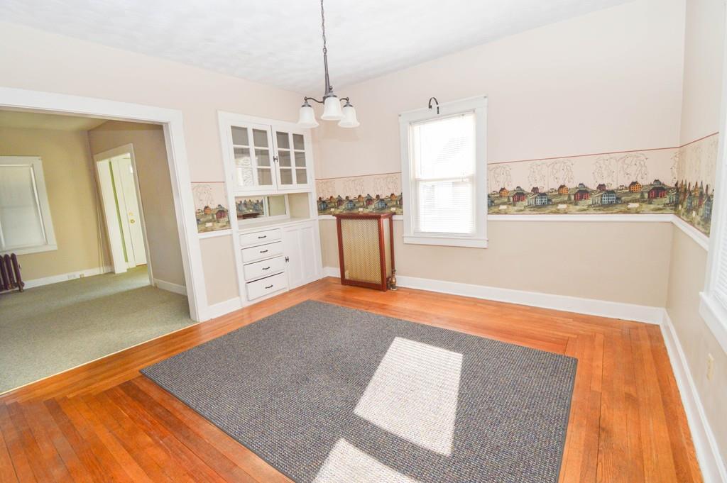174 Pasco Road Springfield, MA 01151 - Photo 11 of 21 a view of a kitchen with furniture and wooden floor