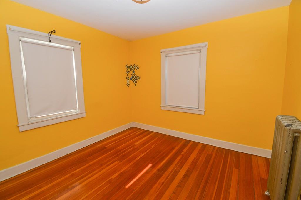 174 Pasco Road Springfield, MA 01151 - Photo 16 of 21 a view of a room with wooden floor and a window