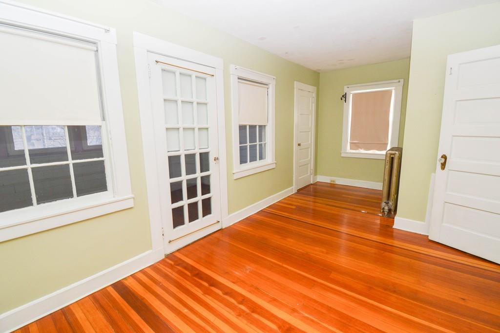 174 Pasco Road Springfield, MA 01151 - Photo 20 of 21 a view of an empty room with wooden floor and a window