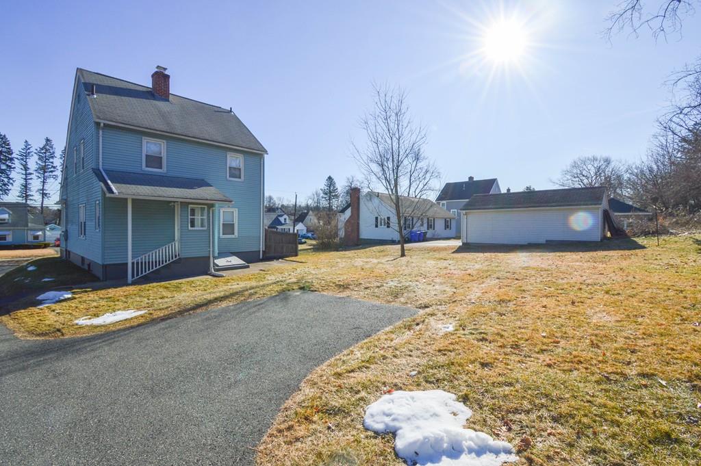 174 Pasco Road Springfield, MA 01151 - Photo 4 of 21 a view of a house with a yard and sitting area