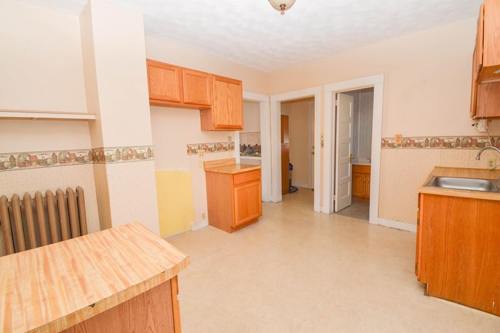 174 Pasco Road Springfield, MA 01151 - Photo 7 of 21 a bedroom with a bed and a view of kitchen