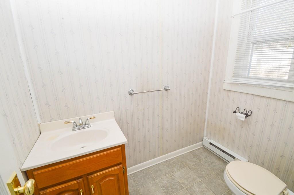 174 Pasco Road Springfield, MA 01151 - Photo 10 of 21 a bathroom with a sink a toilet and shower