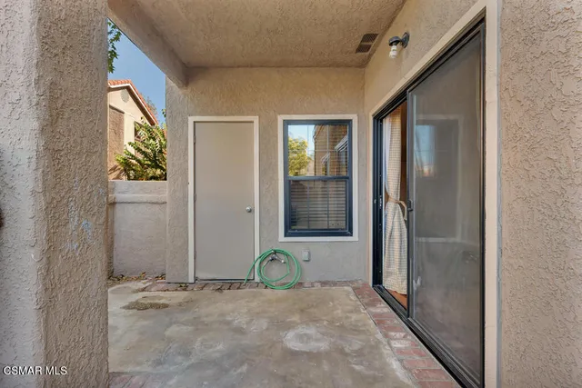 a view of a brick house with front door