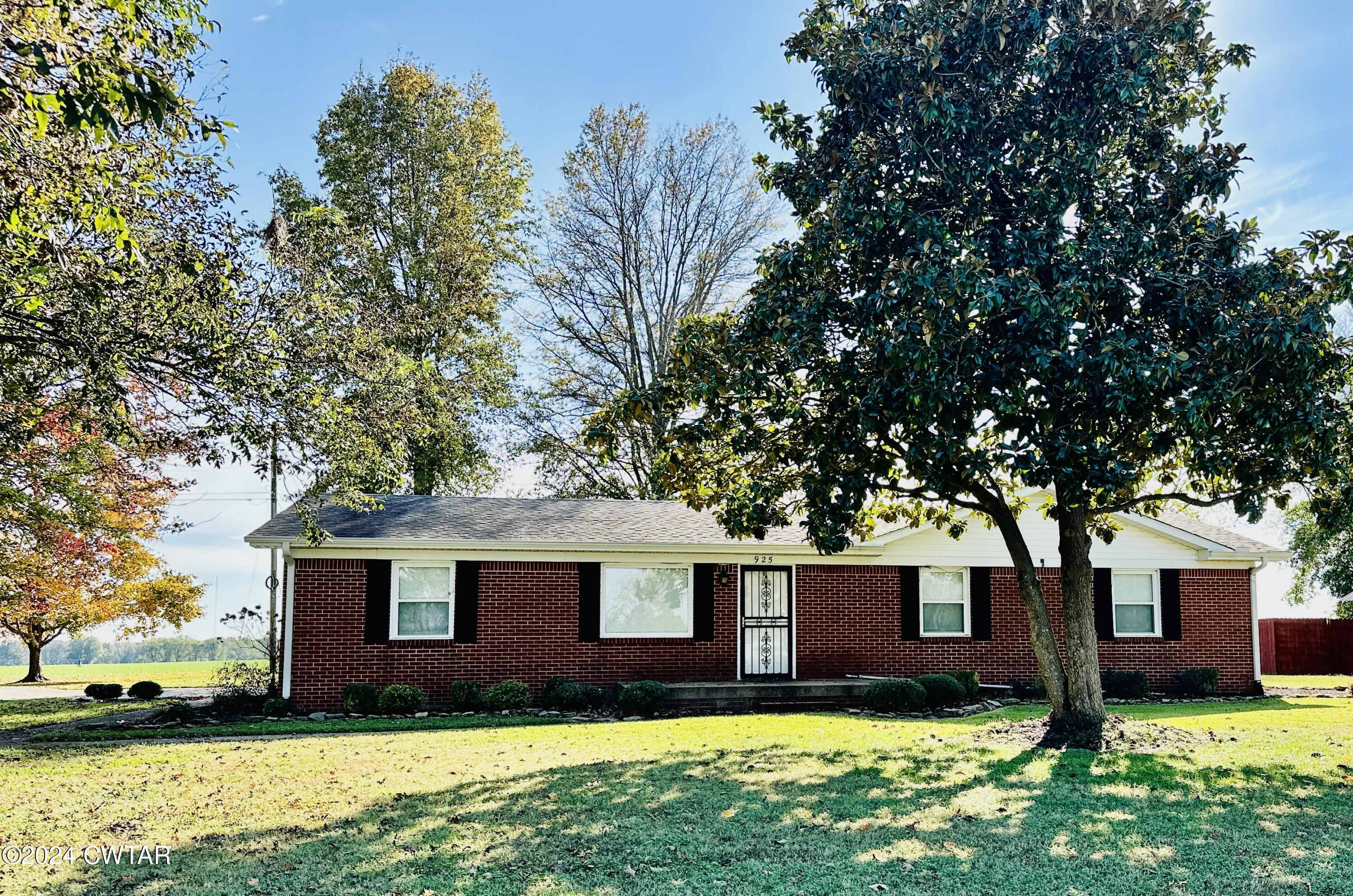 925 McKnight Street Rutherford, TN 38369 - Photo 1 of 23 a front view of house with yard and trees in the background