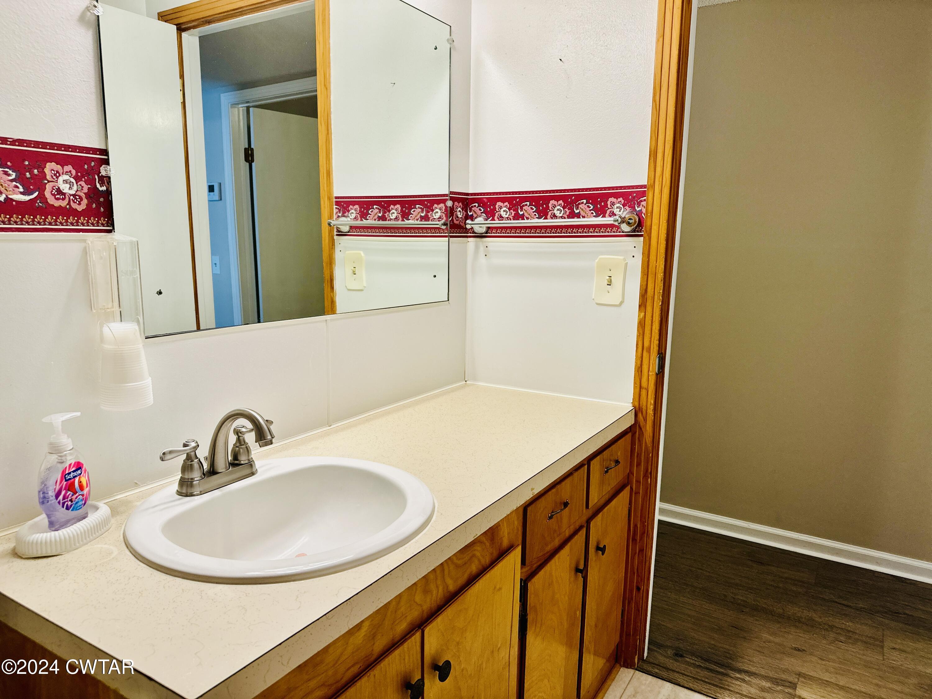 925 McKnight Street Rutherford, TN 38369 - Photo 14 of 23 a bathroom with a sink and a mirror