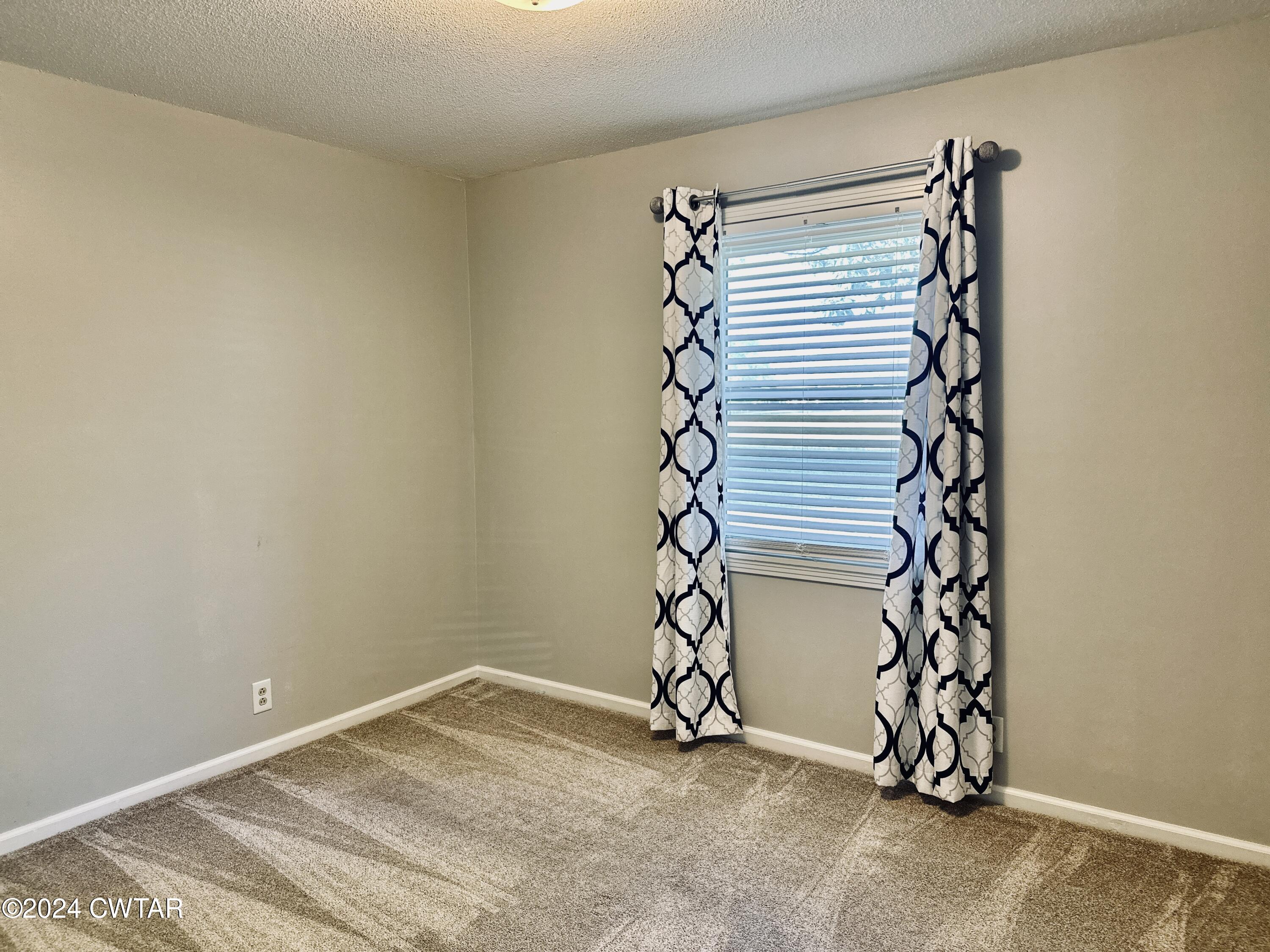 925 McKnight Street Rutherford, TN 38369 - Photo 16 of 23 a view of a room with wooden walls and a window