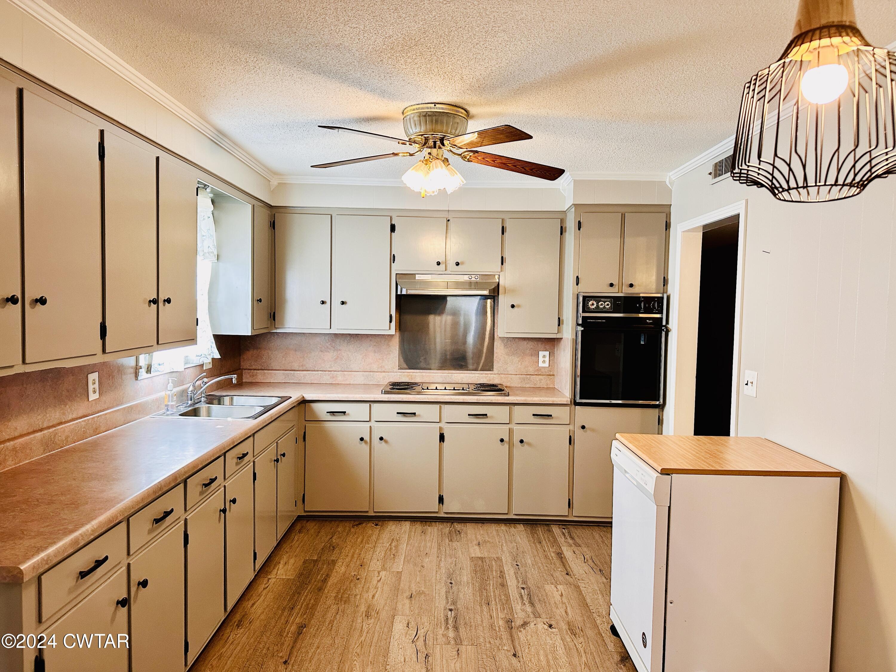 925 McKnight Street Rutherford, TN 38369 - Photo 6 of 23 a kitchen with stainless steel appliances a sink stove and refrigerator