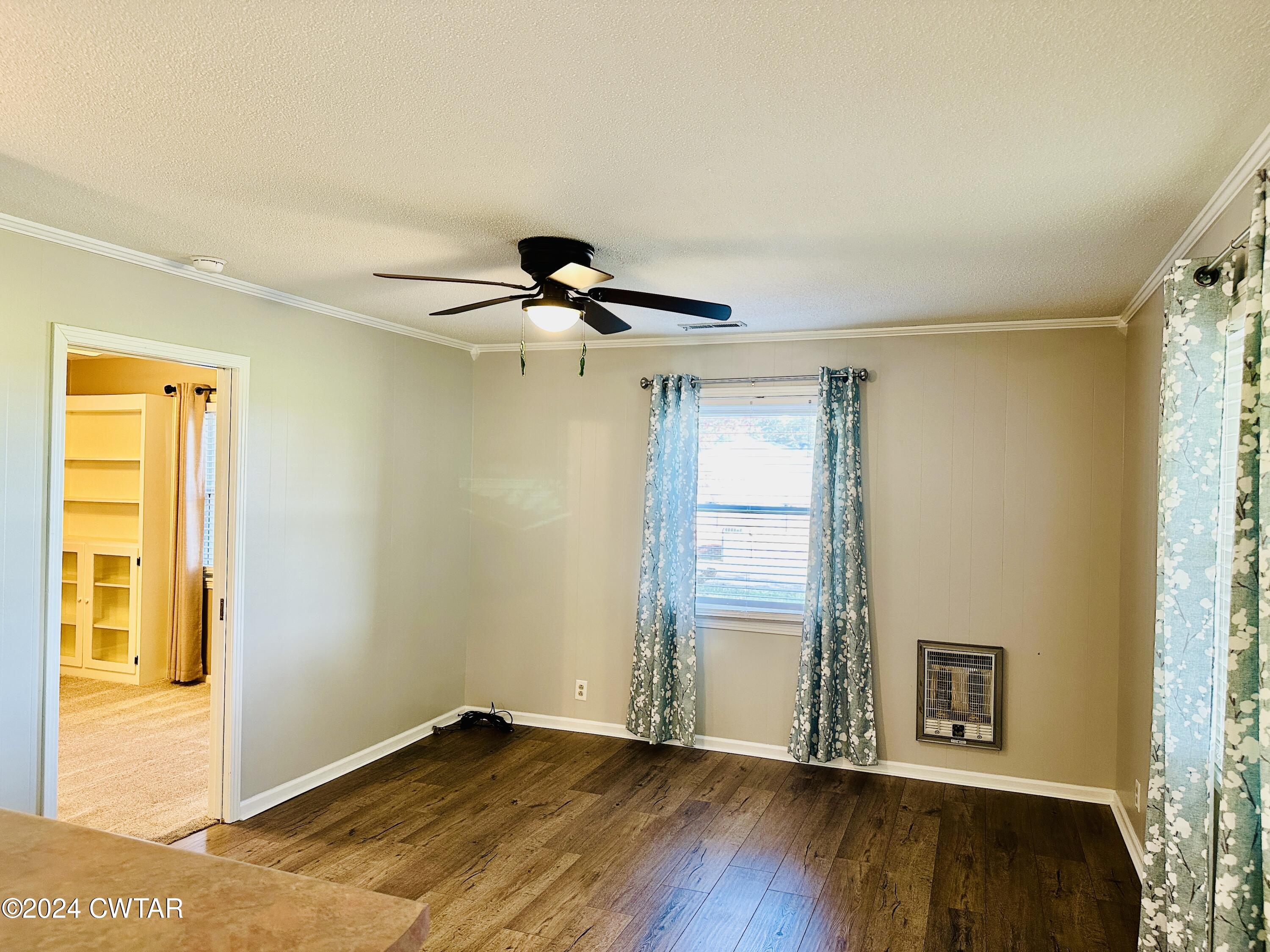 925 McKnight Street Rutherford, TN 38369 - Photo 7 of 23 a view of room with a ceiling fan and wooden floor