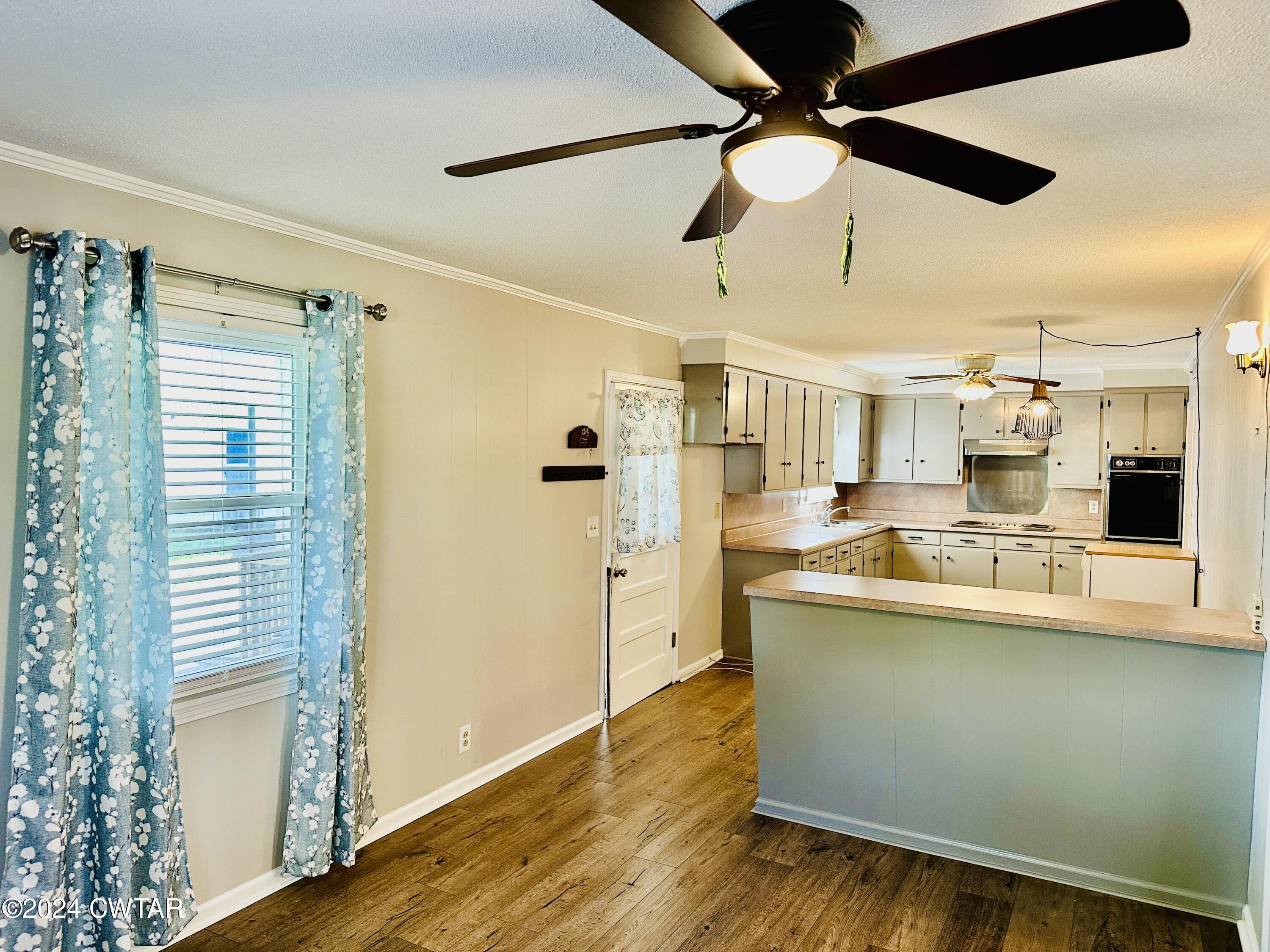 925 McKnight Street Rutherford, TN 38369 - Photo 8 of 23 a large white kitchen with a large window appliances and cabinets