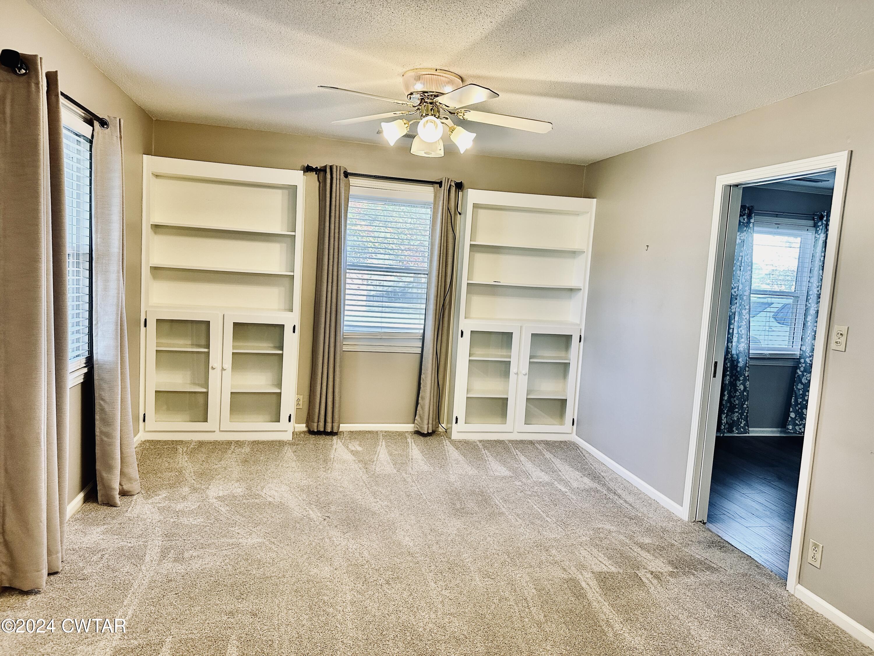 925 McKnight Street Rutherford, TN 38369 - Photo 10 of 23 a view of an empty room with a ceiling fan and window