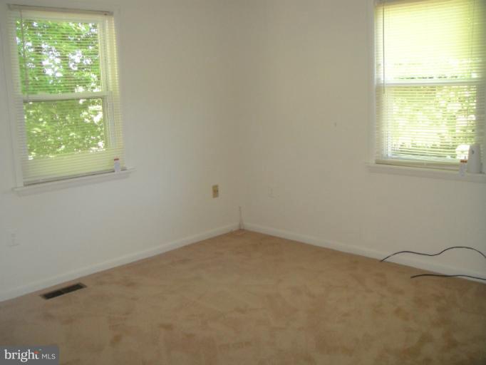 660 West Mount Harmony Road Owings, MD 20736 - Photo 12 of 26 Main level Master bedroom
