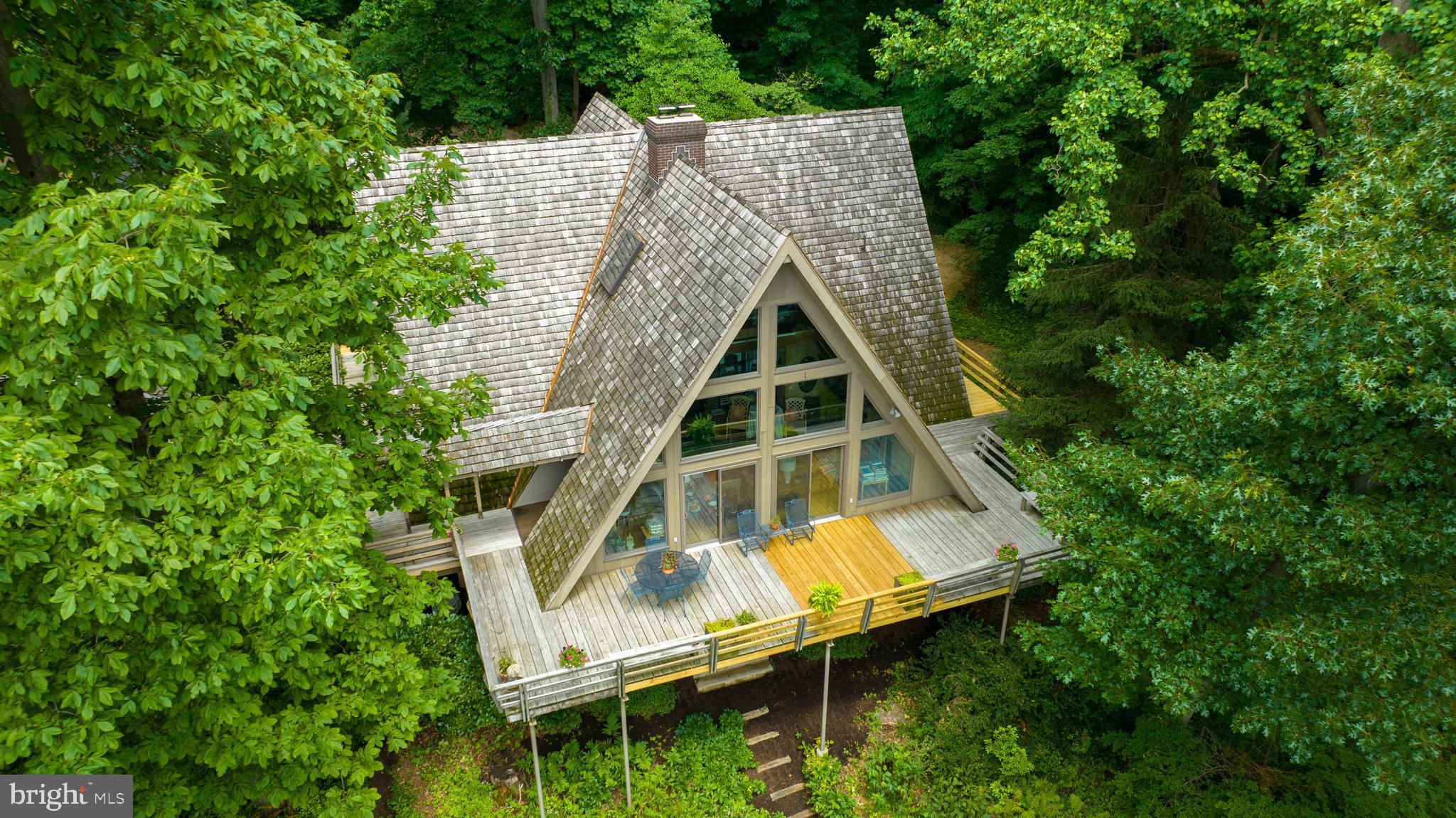 2487 Chestnut Ridge Drive Lancaster, PA 17601 - Photo 29 of 96 an aerial view of a house with swimming pool and trees in the background