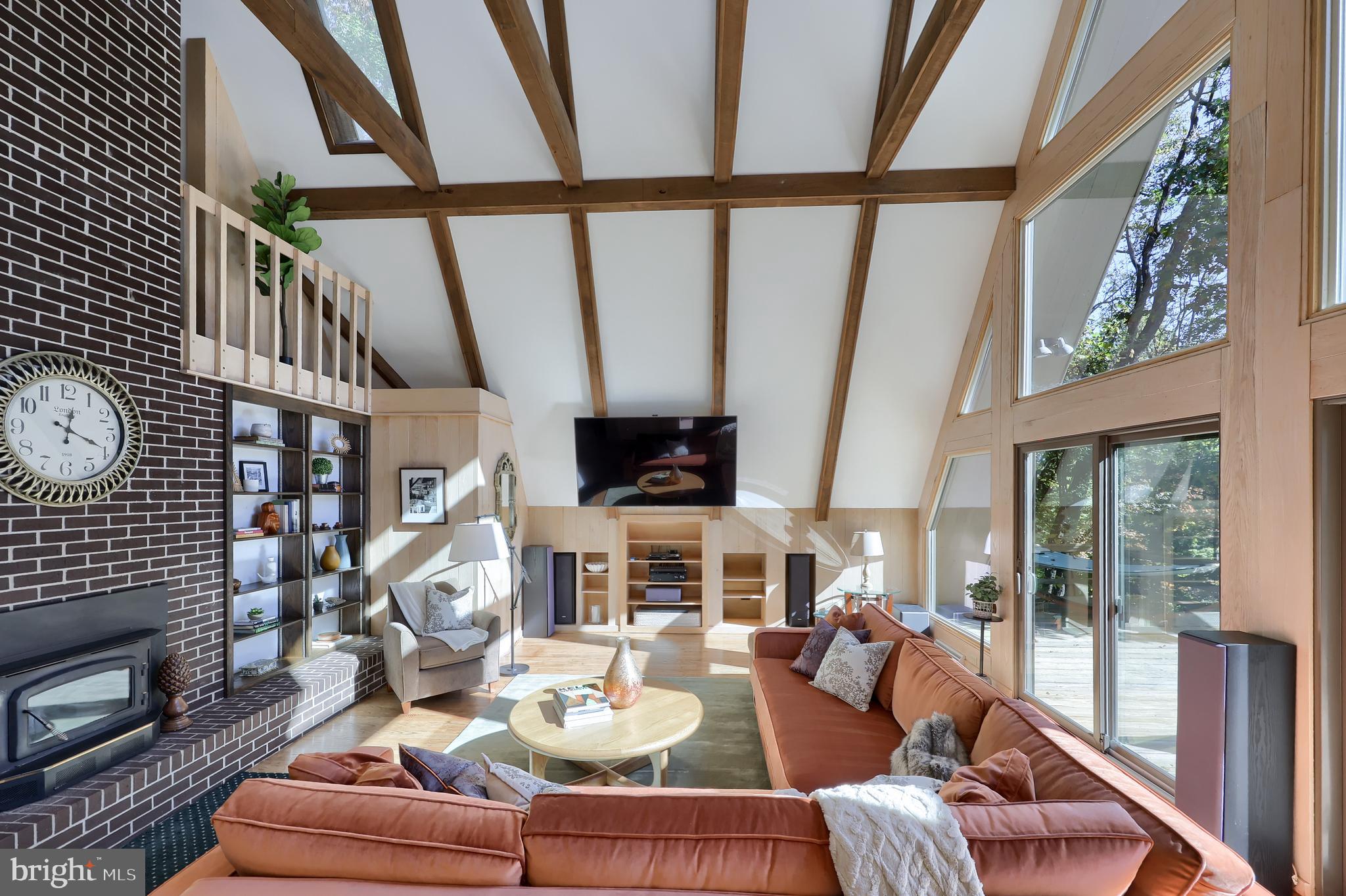 2487 Chestnut Ridge Drive Lancaster, PA 17601 - Photo 36 of 96 a living room with fireplace furniture and a floor to ceiling window