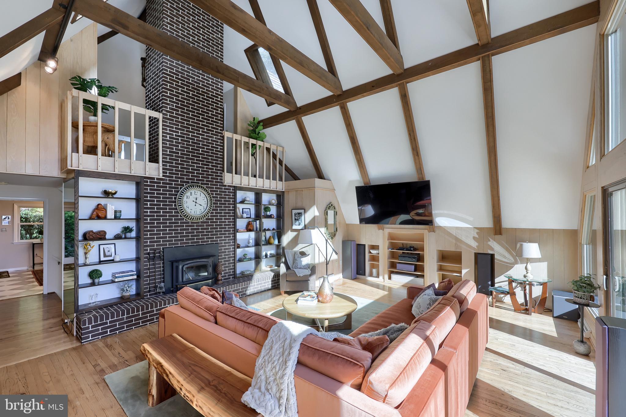 2487 Chestnut Ridge Drive Lancaster, PA 17601 - Photo 37 of 96 a living room with furniture a flat screen tv and a fireplace