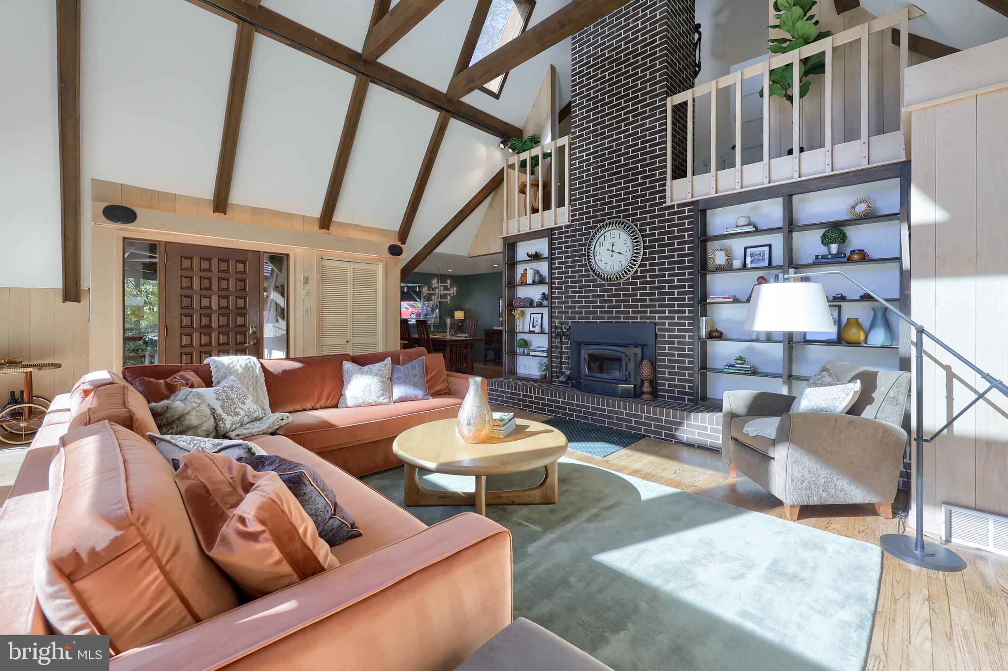 2487 Chestnut Ridge Drive Lancaster, PA 17601 - Photo 38 of 96 a living room with furniture a fireplace and a large window
