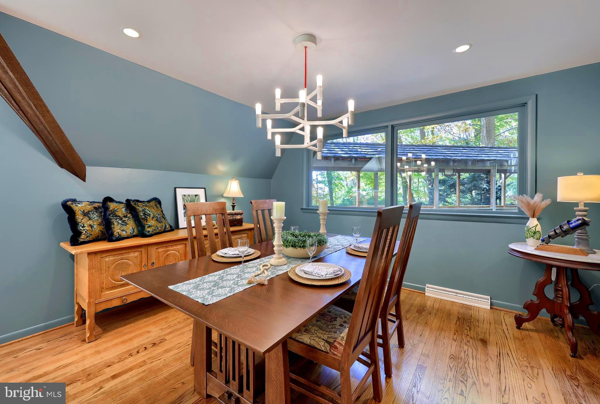 2487 Chestnut Ridge Drive Lancaster, PA 17601 - Photo 42 of 96 a view of a dining room with furniture a chandelier and wooden floor