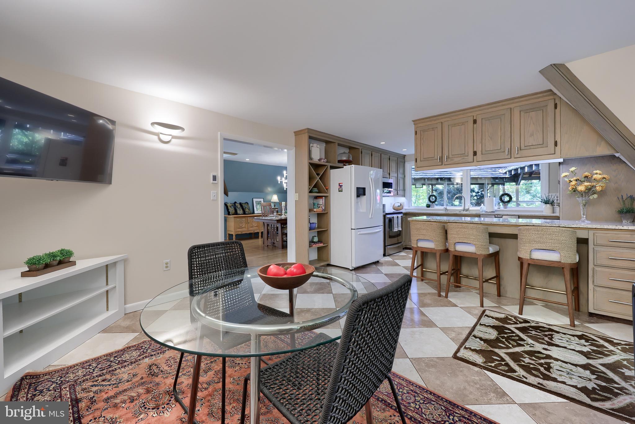 2487 Chestnut Ridge Drive Lancaster, PA 17601 - Photo 49 of 96 a living room with stainless steel appliances kitchen island granite countertop a table and chairs