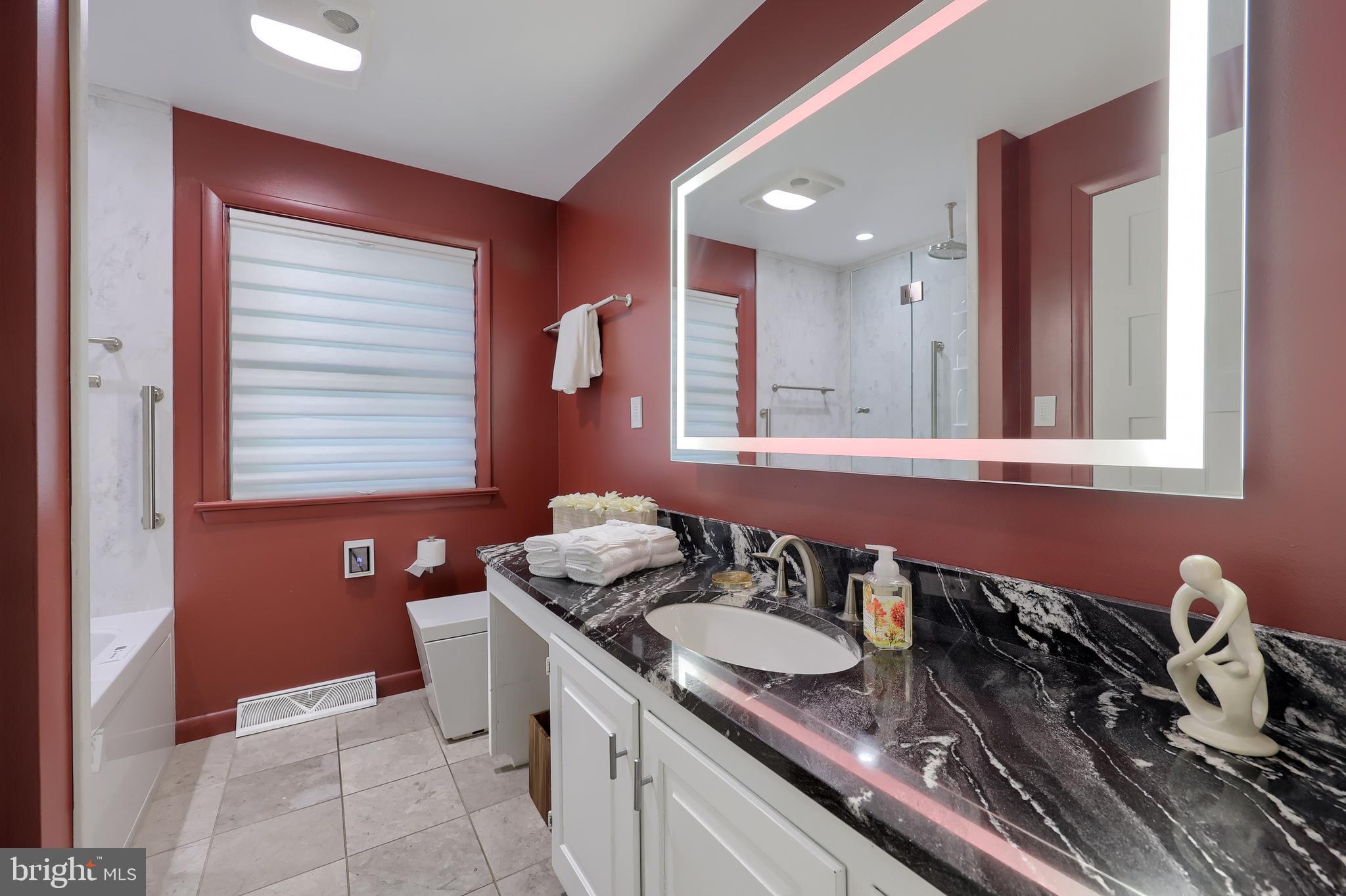2487 Chestnut Ridge Drive Lancaster, PA 17601 - Photo 52 of 96 a bathroom with a granite countertop sink and a mirror
