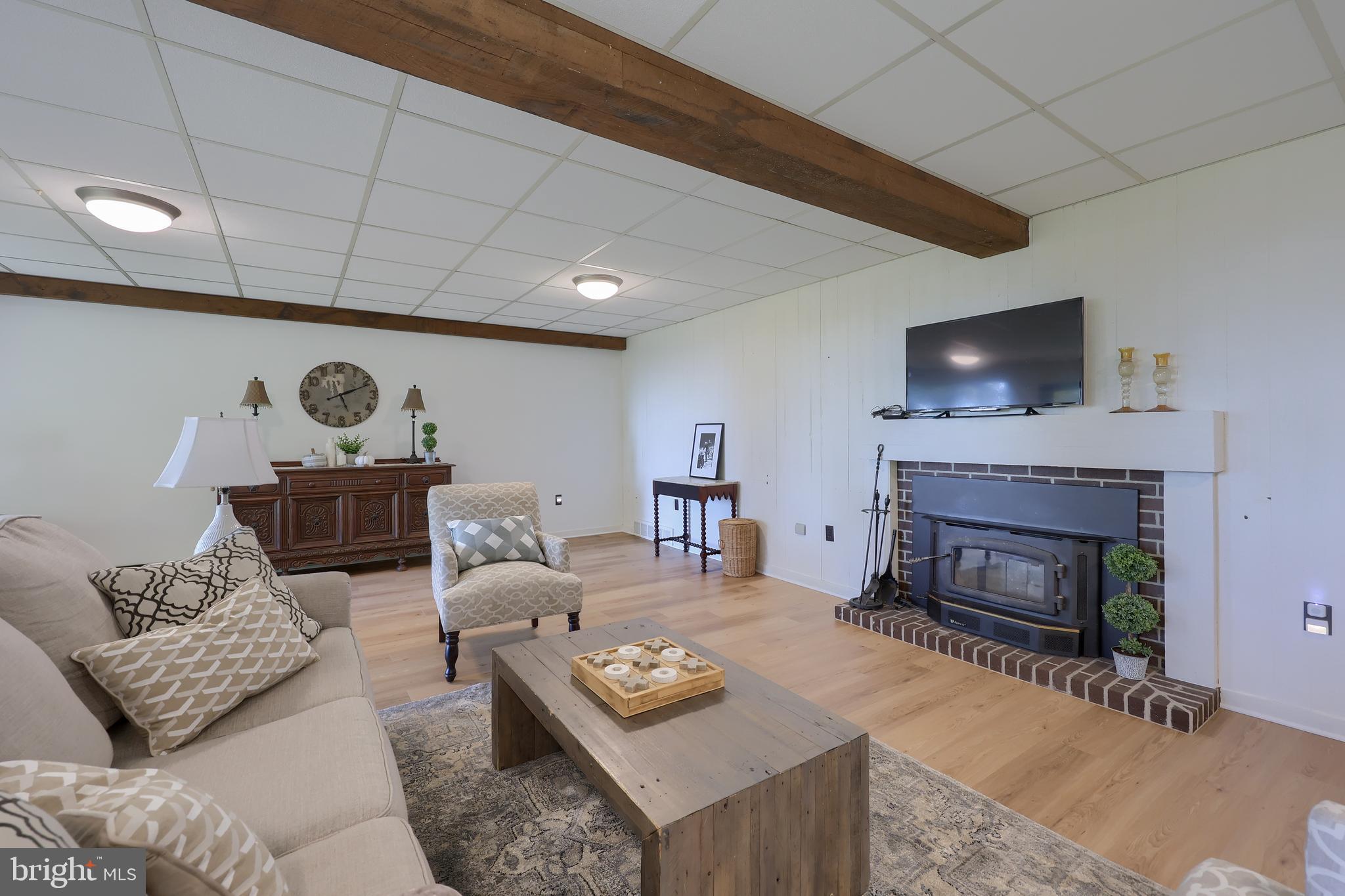 2487 Chestnut Ridge Drive Lancaster, PA 17601 - Photo 84 of 96 a living room with furniture and a fireplace