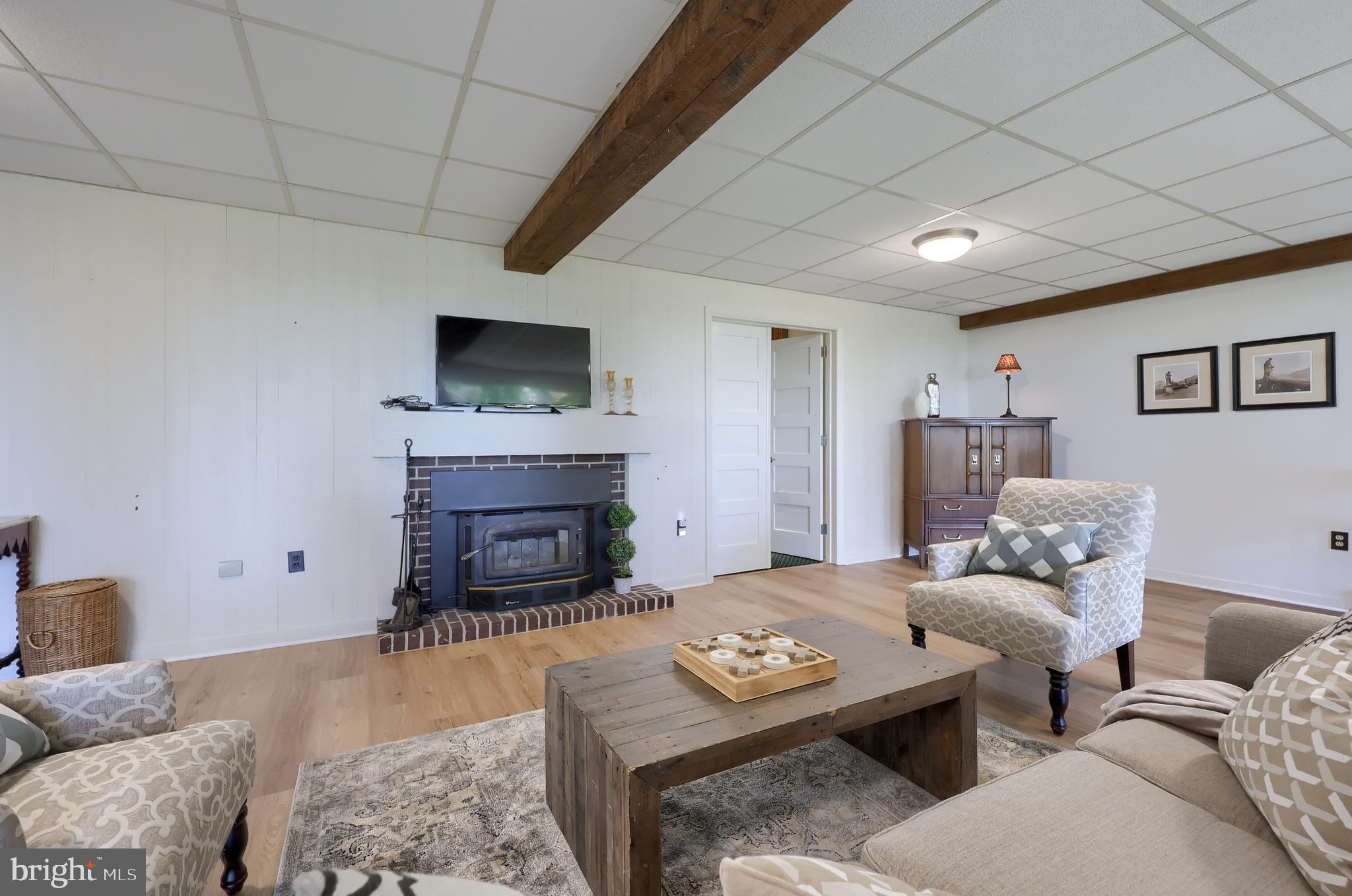 2487 Chestnut Ridge Drive Lancaster, PA 17601 - Photo 86 of 96 a living room with furniture and a fireplace