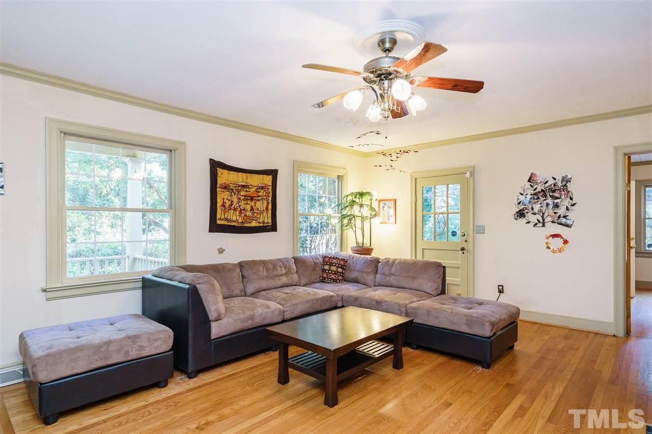 205 Lord Berkley Road Raleigh, NC 27610 - Photo 11 of 25 a living room with furniture and a large window