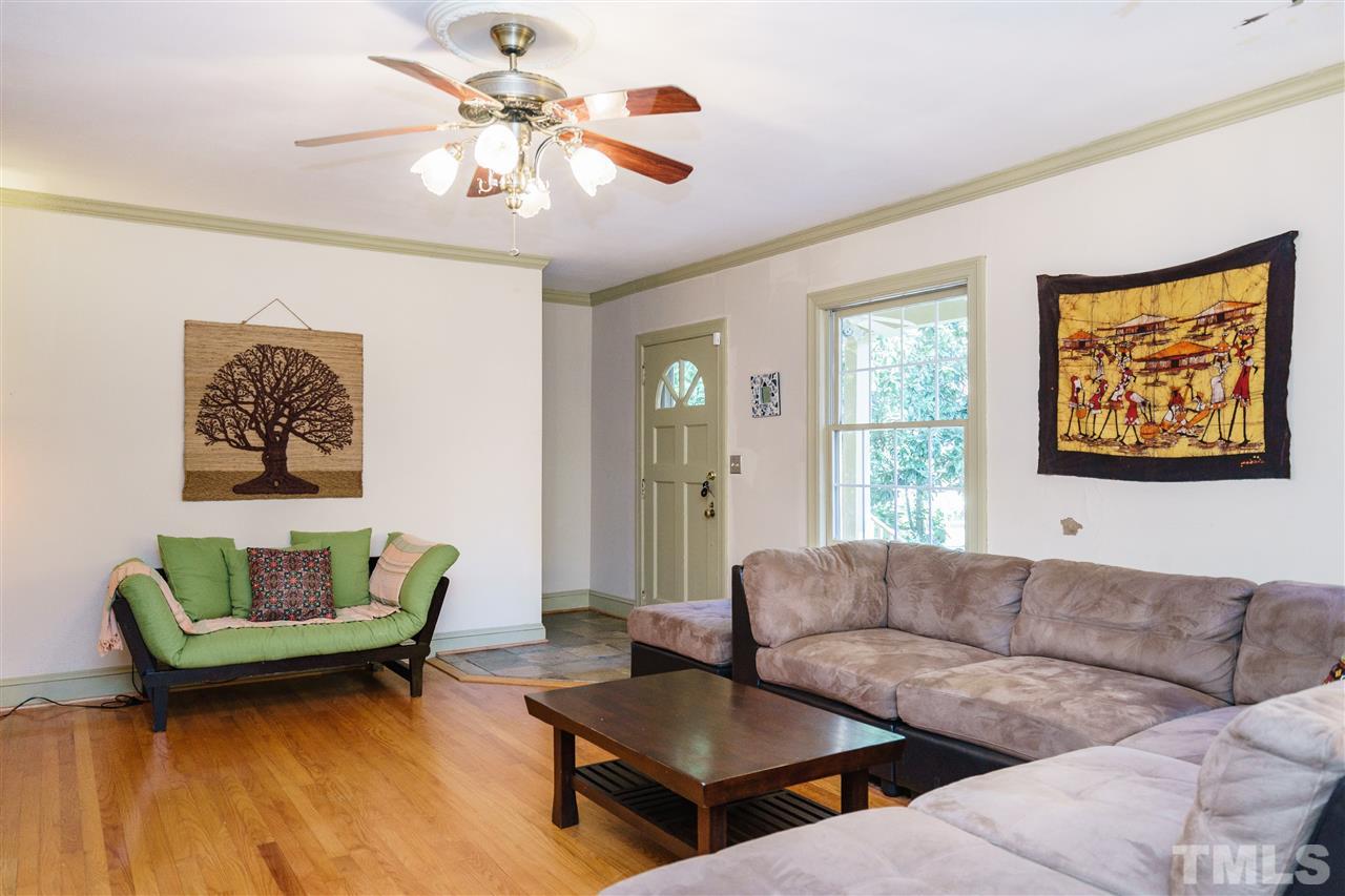 205 Lord Berkley Road Raleigh, NC 27610 - Photo 12 of 25 a living room with furniture and a large window