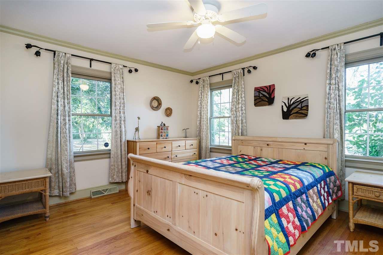 205 Lord Berkley Road Raleigh, NC 27610 - Photo 25 of 25 a bedroom with a bed and a window