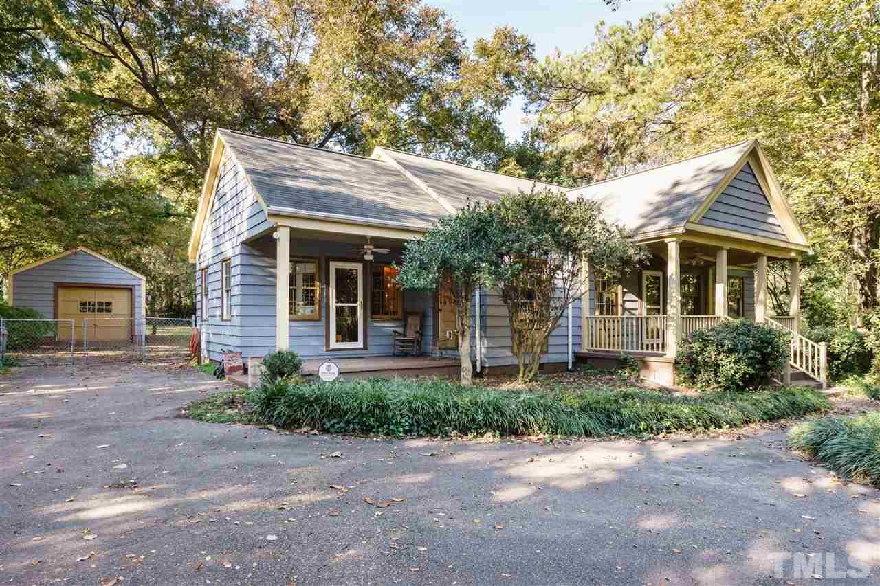 205 Lord Berkley Road Raleigh, NC 27610 - Photo 3 of 25 a front view of a house with a garden