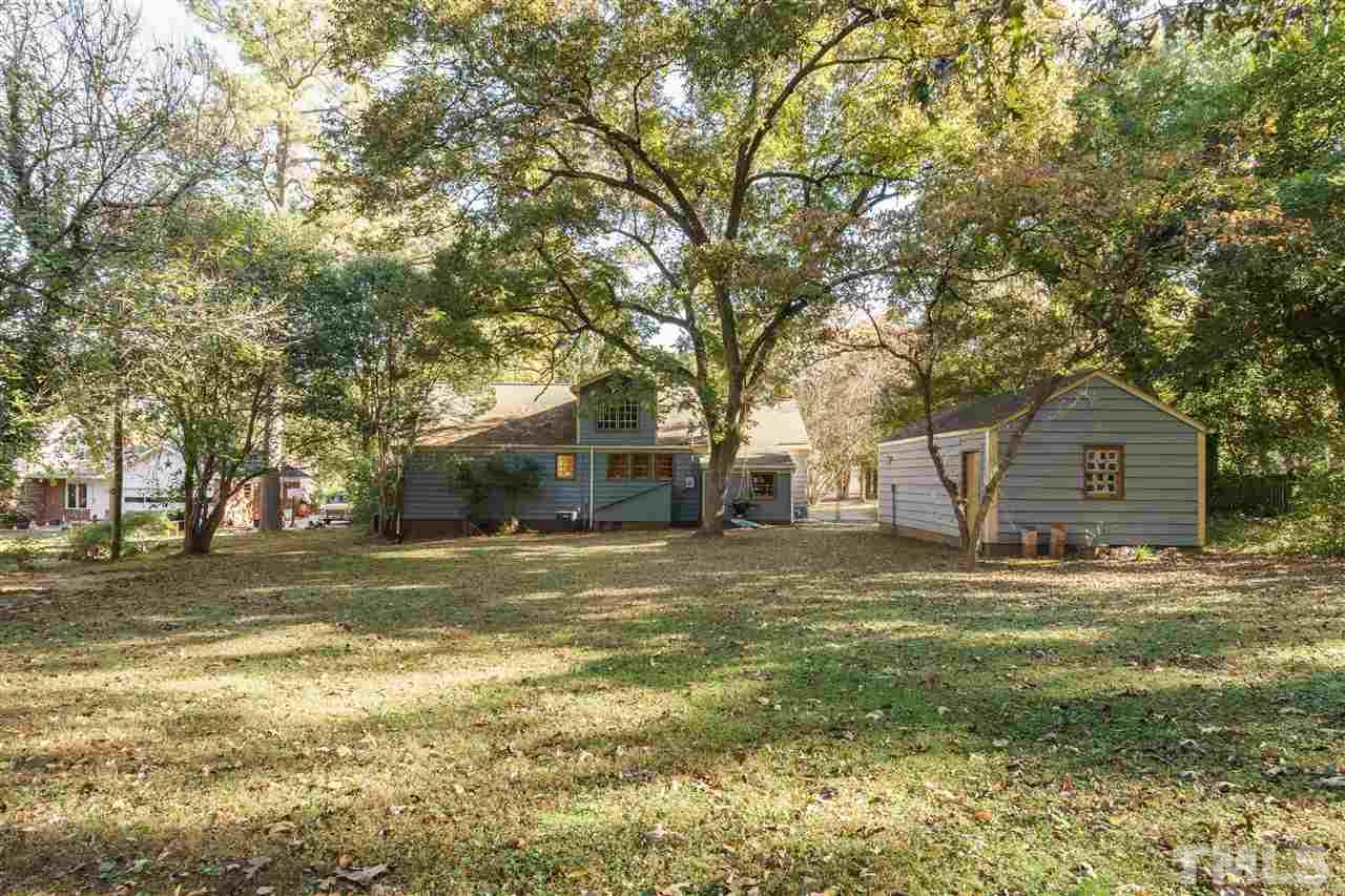 205 Lord Berkley Road Raleigh, NC 27610 - Photo 22 of 25 a front view of a house with a yard