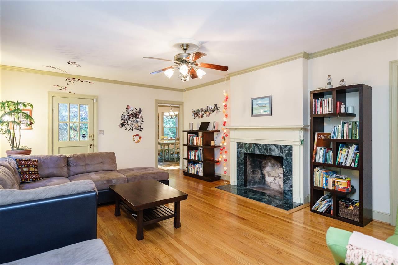 205 Lord Berkley Road Raleigh, NC 27610 - Photo 9 of 25 a living room with furniture and a fireplace