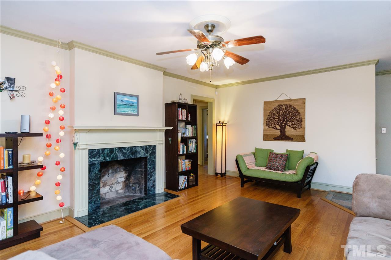 205 Lord Berkley Road Raleigh, NC 27610 - Photo 10 of 25 a living room with furniture and a fireplace